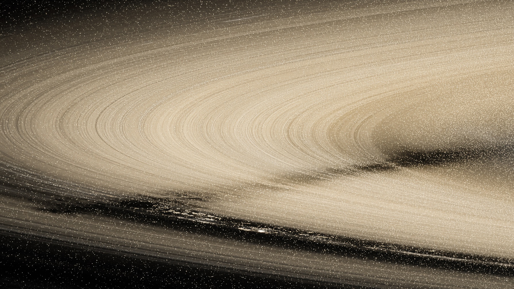 Illustration of a thin, detached ice ring around Saturn