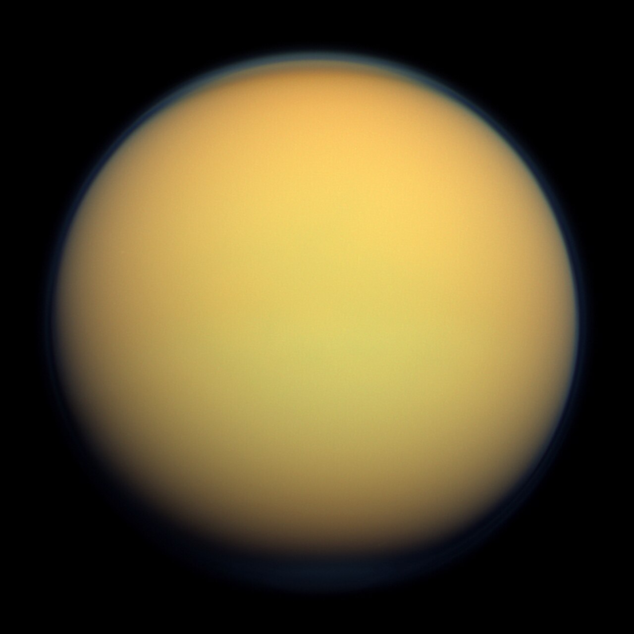 Titan, a hazy orange world with a dense atmosphere